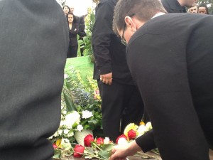 Eric's Dad lays a rose